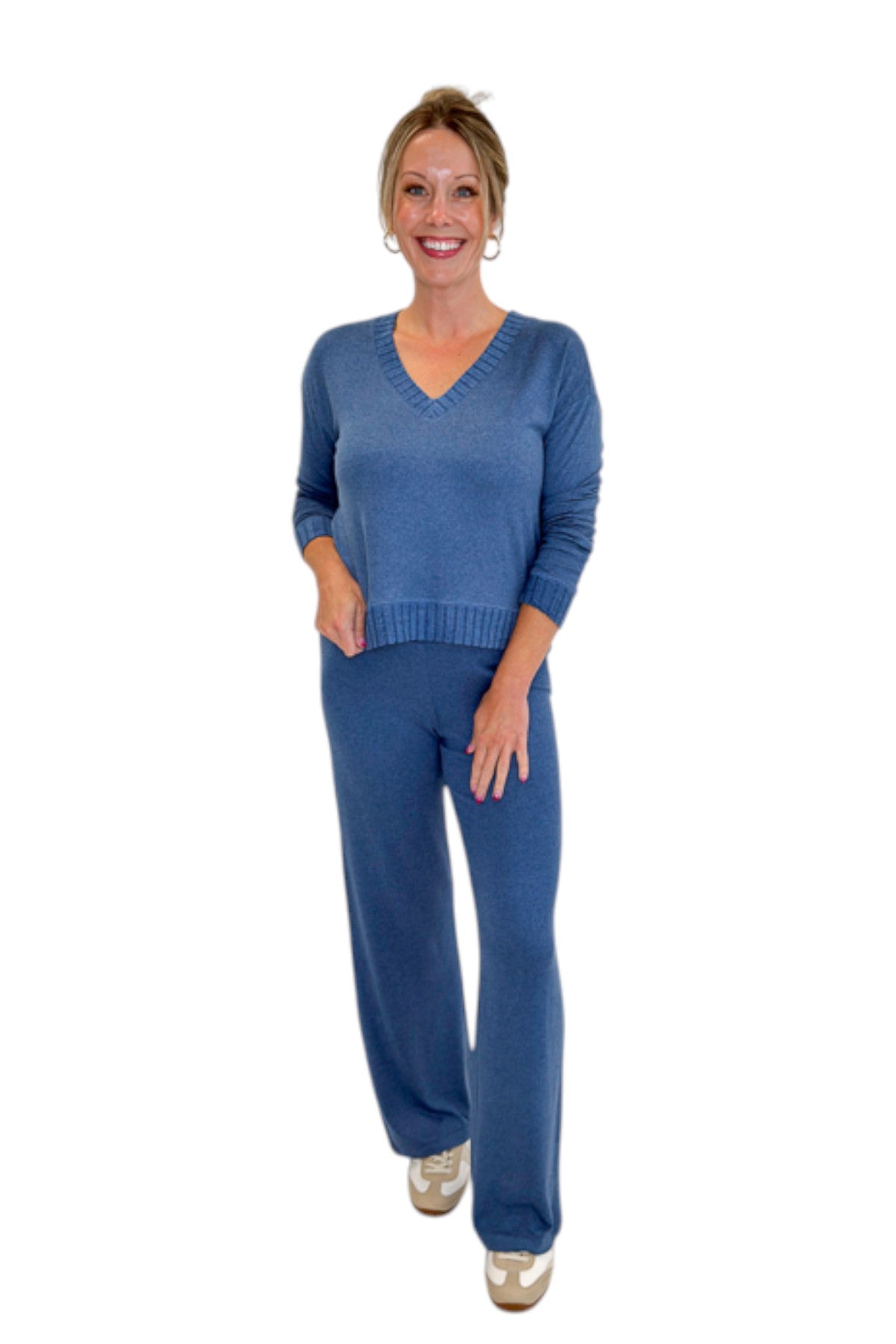 Front view of woman wearing Swagger Boutique’s True Navy Courtney Long Sleeve Top by Z Supply with True Navy Dawn Smocked Pants by Z Supply against white studio background.