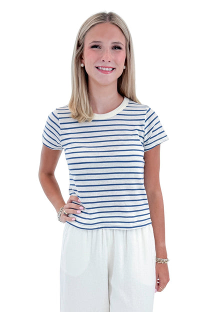 Front view of woman wearing Swagger Boutique’s True Navy Junie Striped Tee by Z Supply with White Scout Linen Pants by Z Supply against white studio background.