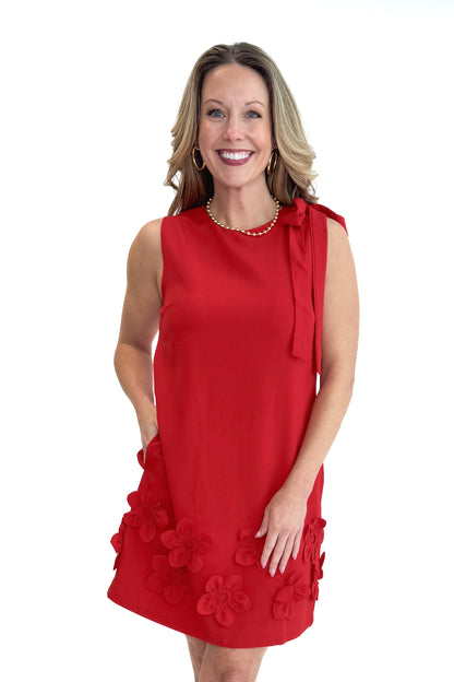 Front view of woman wearing Red With Floral Applique Shift Dress by THML against white studio background.