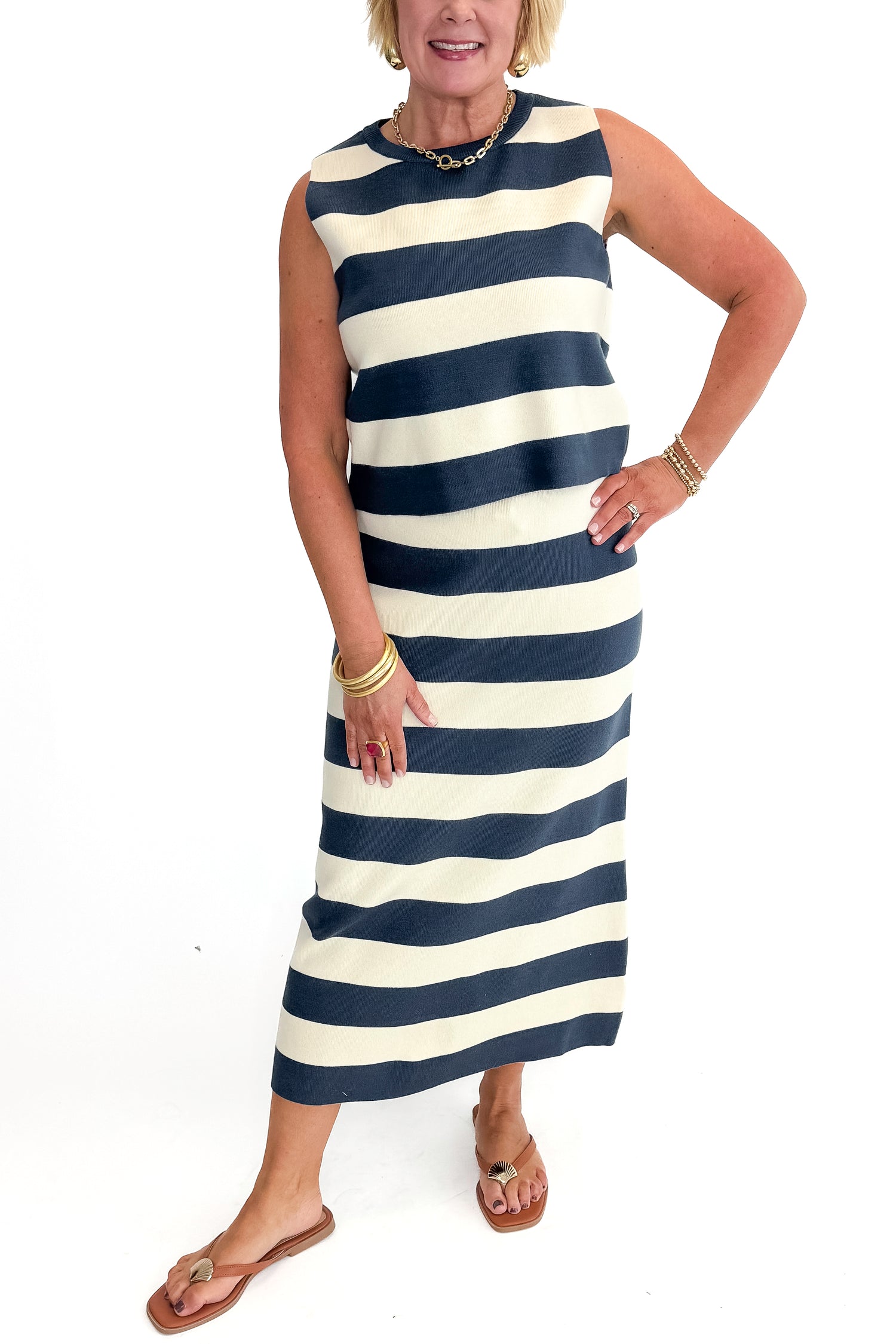 Front view of woman wearing Navy &amp; Cream Striped Midi Skirt with matching tank against white studio background.