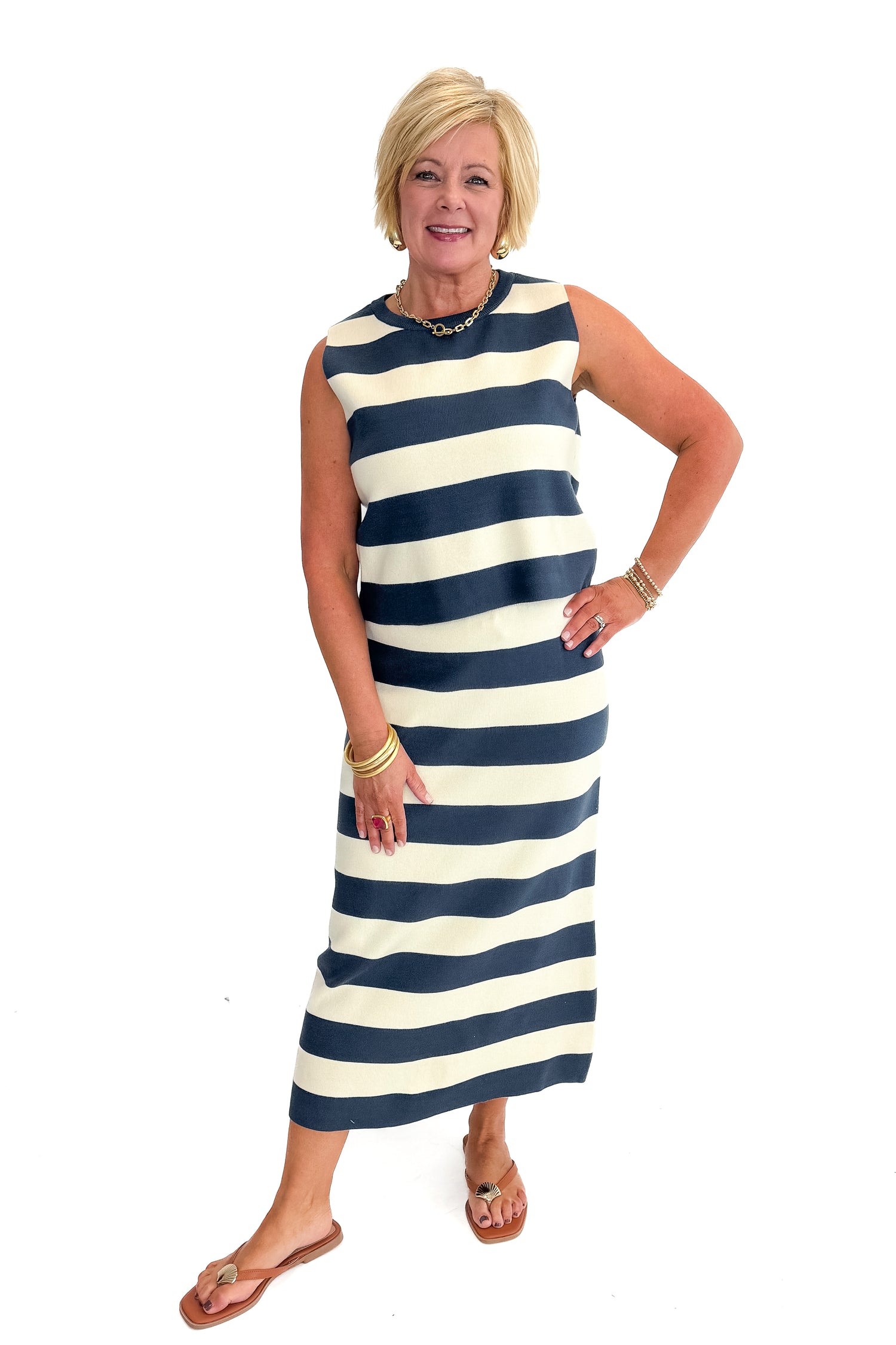 Front view of woman wearing Navy &amp; Cream Striped Midi Skirt with matching tank against white studio background.