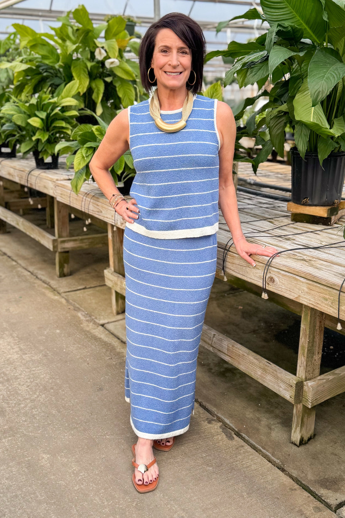 Front view of woman wearing Blue &amp; Cream Striped Knit Tank with matching skirt against white studio background.