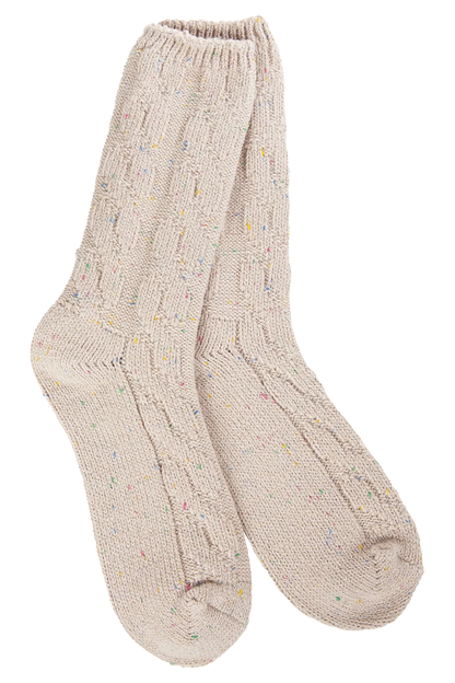 Pair of beige socks with subtle pattern on a white background