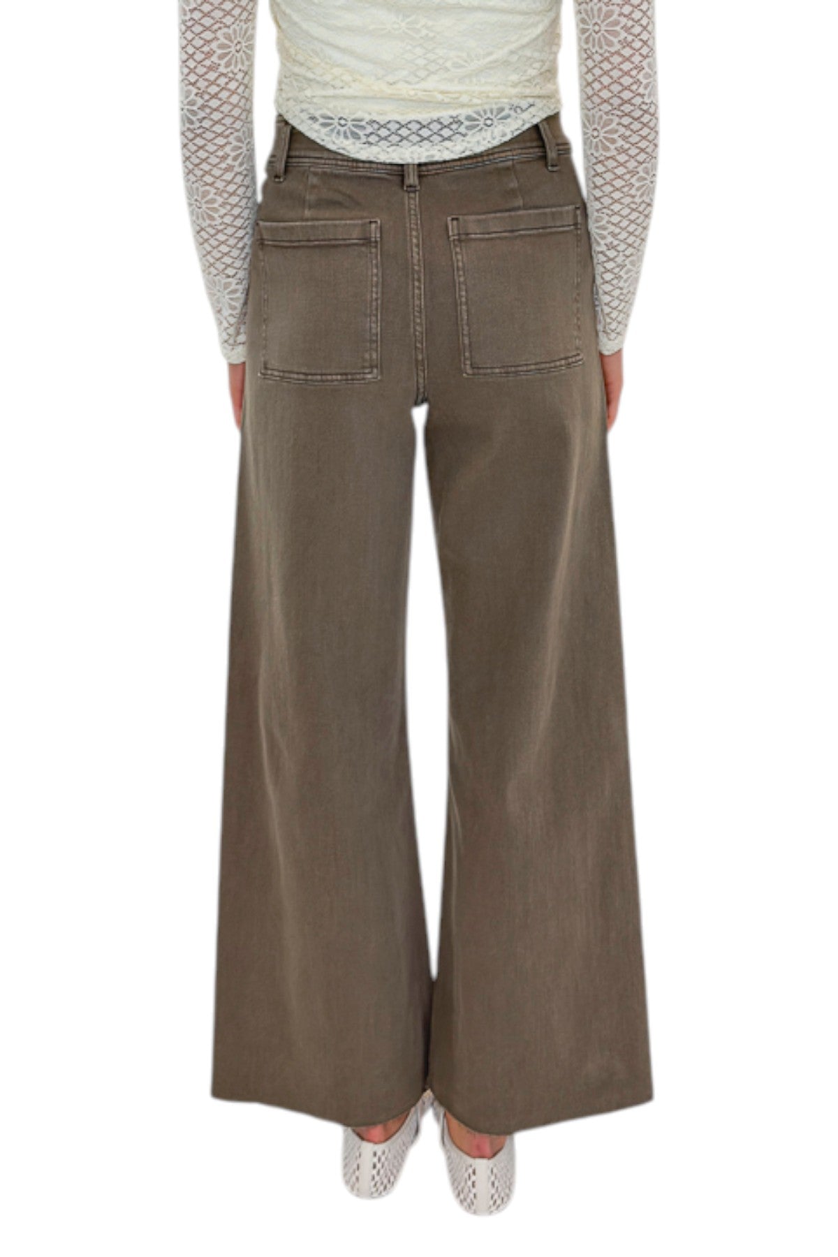 Back view of woman wearing Swagger Boutique’s Washed Brown Patch Pocket Wide Leg Jeans with top against white studio background.