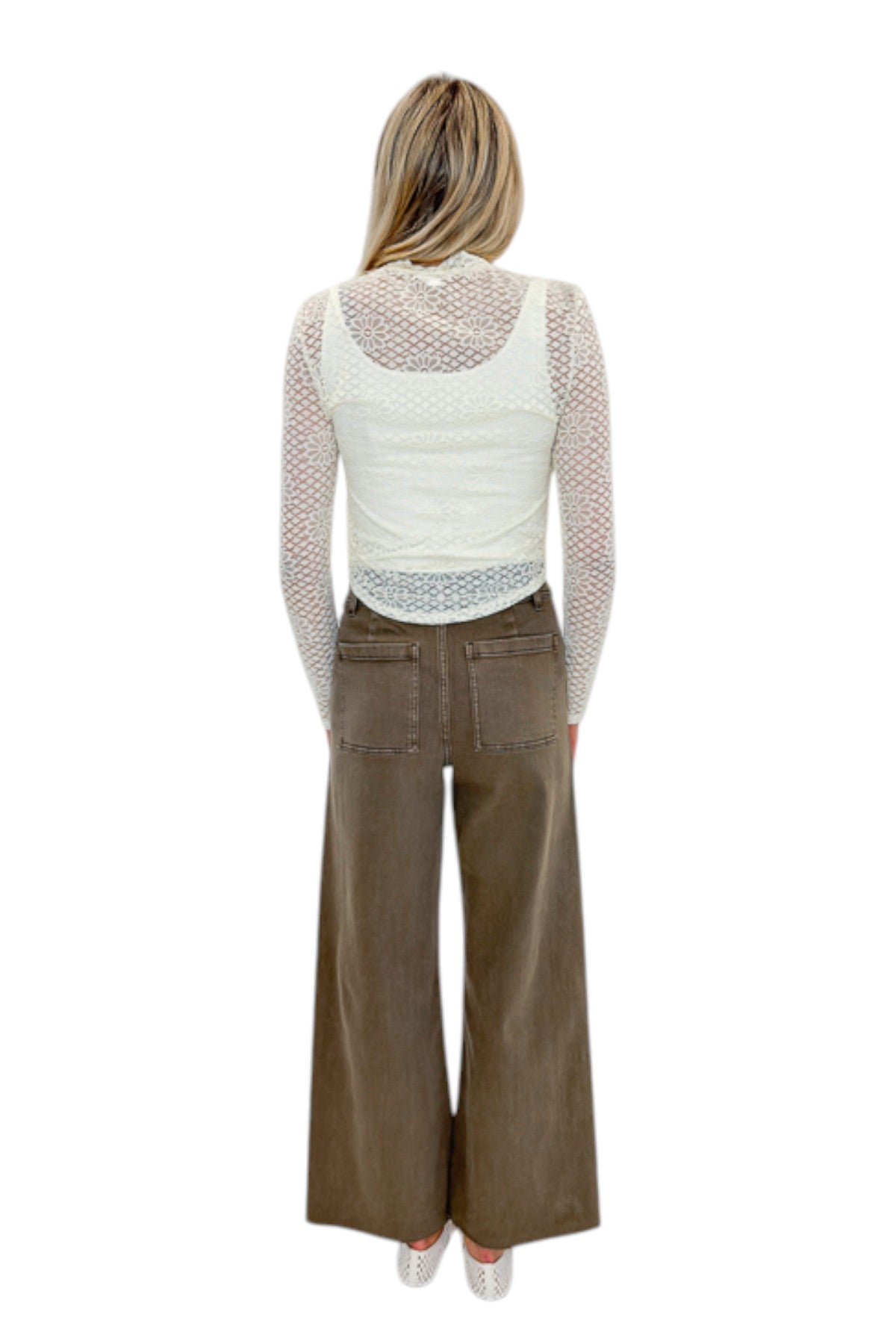 Back view of woman wearing Swagger Boutique’s Washed Brown Patch Pocket Wide Leg Jeans with top against white studio background.