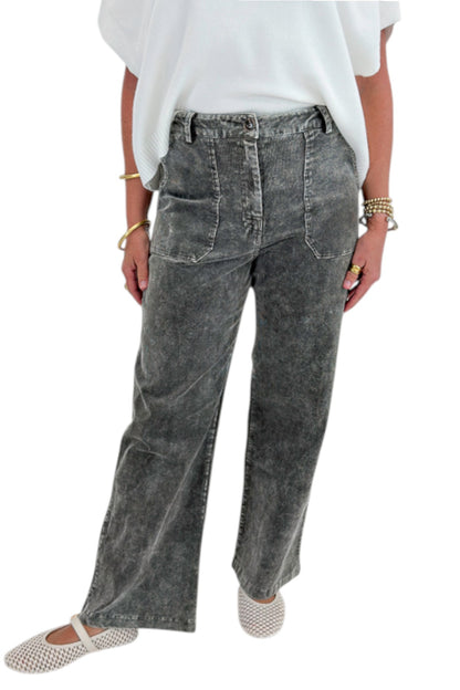 Front detail view of woman wearing Swagger Boutique’s Ivory Light Weight Short Sleeve Sweater with Washed Stone Corduroy Pants against white studio background.