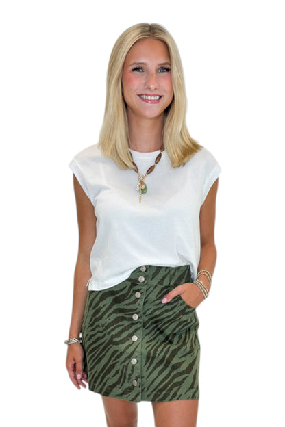 Front view of woman wearing Swagger Boutique’s White Flex Sleeveless Tee by Z Supply against white studio background.