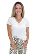 Front view of woman wearing Swagger Boutique’s White Nomad V-Neck Tee by Z Supply with jeans against white studio background.