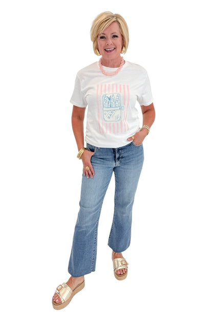 Front view of woman wearing Swagger Boutique’s White Sardine Graphic T-Shirt with jeans against white studio background.