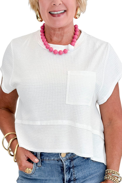 Front detail view of woman wearing Swagger Boutique’s White Waffle Knit Tee with jeans against white studio background.