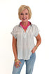 Front view of woman wearing Swagger Boutique’s White & Black Striped Collared Top with jeans and Kaylie necklace against white studio background.