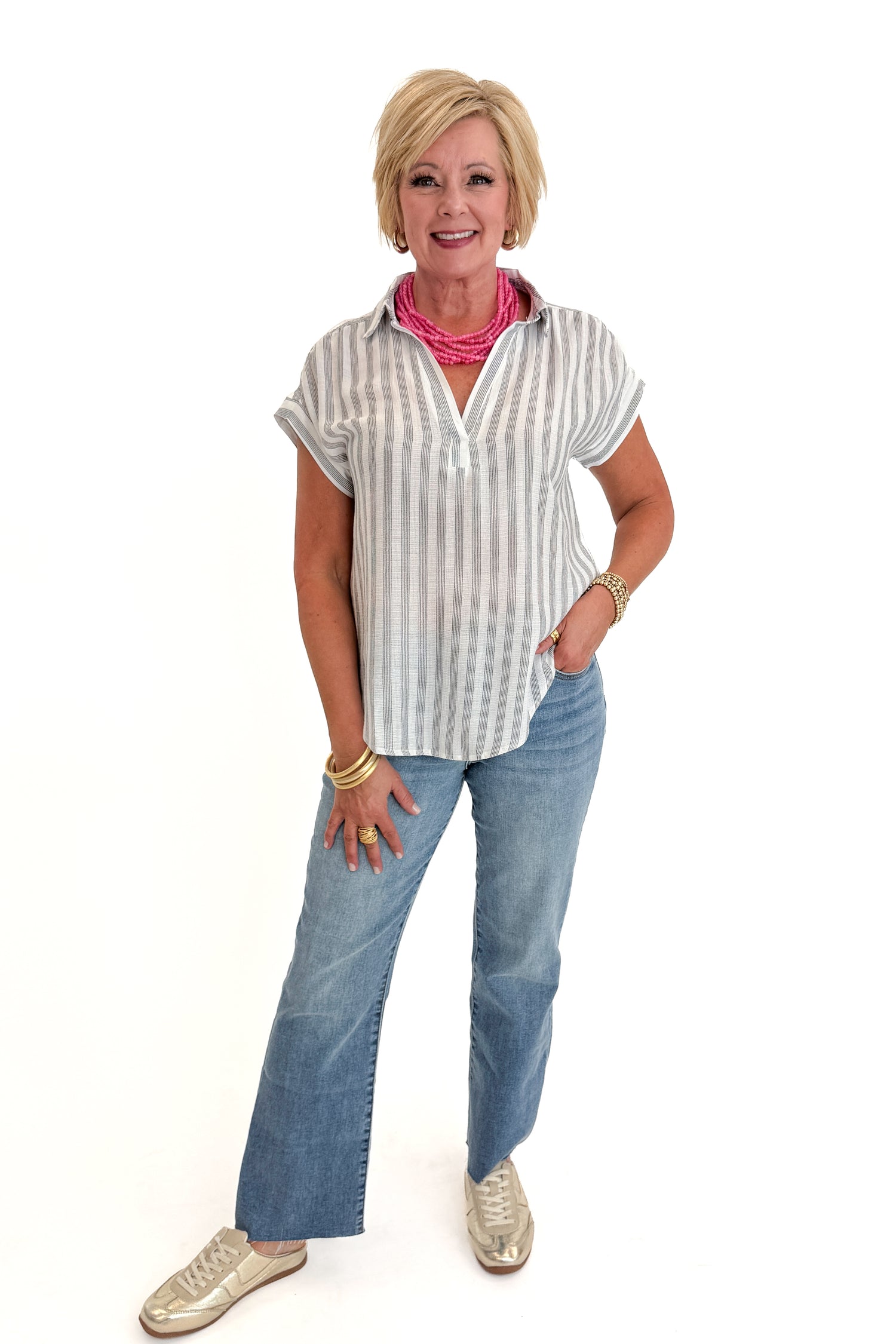 Front view of woman wearing Swagger Boutique’s White &amp; Black Striped Collared Top with jeans and Kaylie necklace against white studio background.