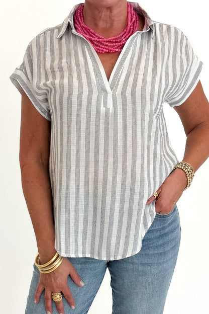 Front detail view of woman wearing Swagger Boutique’s White &amp; Black Striped Collared Top with jeans and Kaylie necklace against white studio background.