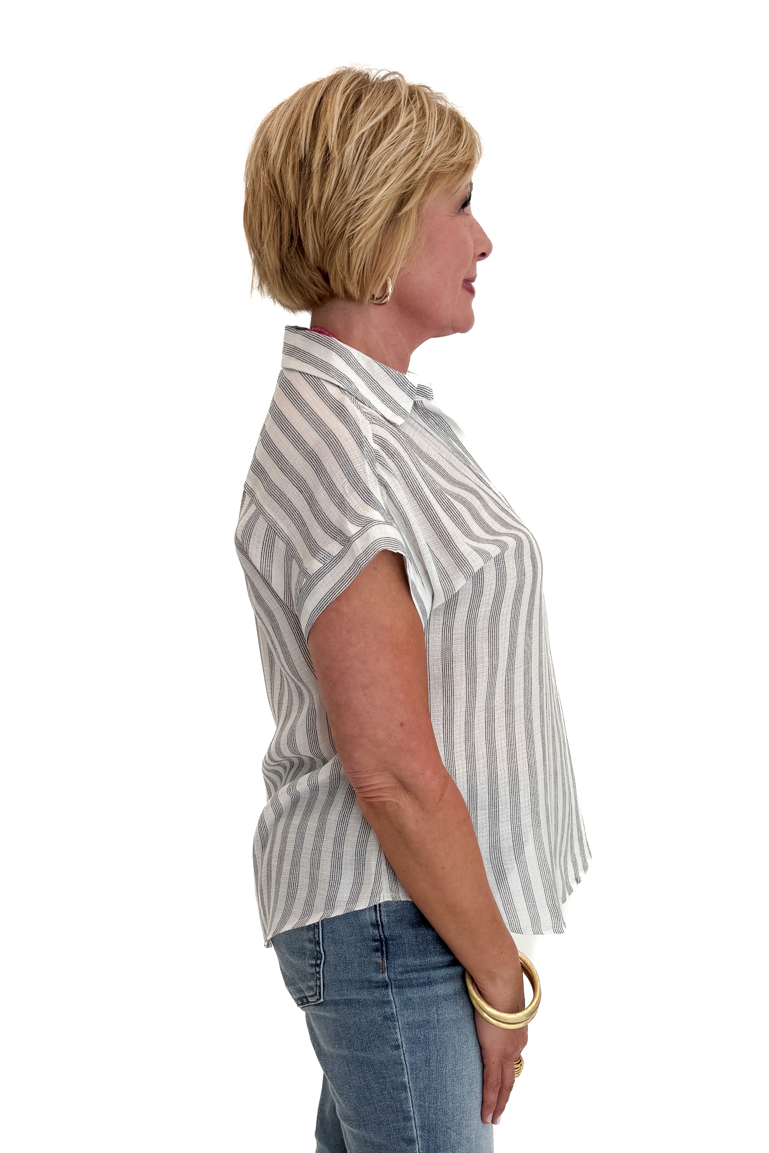 Side view of woman wearing Swagger Boutique’s White &amp; Black Striped Collared Top with jeans and Kaylie necklace against white studio background.