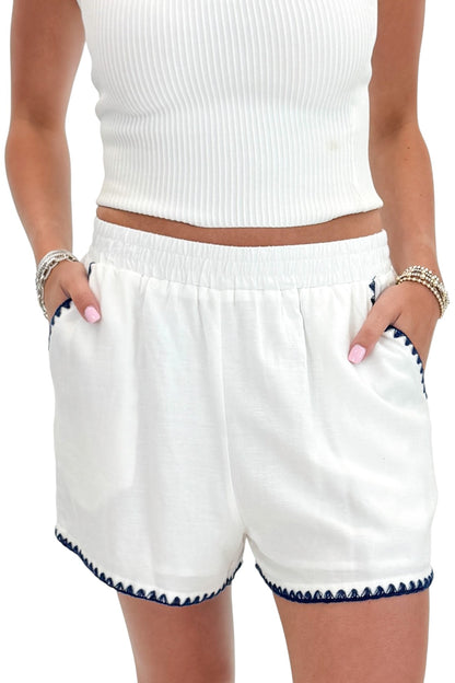 Front detail view of woman wearing Swagger Boutique’s White &amp; Blue Square Neck Stitch Detail Tank with Off White Ribbed Tube Top against white studio background.