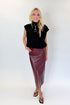 Front view of woman wearing Swagger Boutique’s Wine Faux Leather Slit Midi Skirt with black sweater against white studio background.