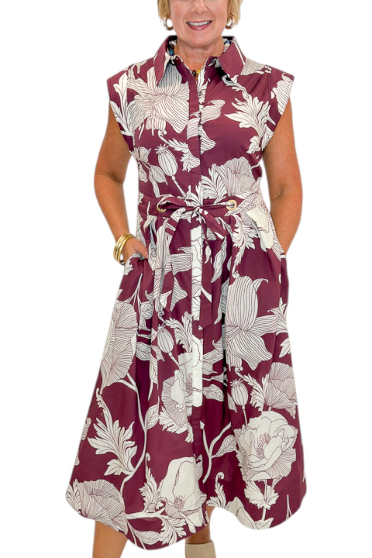 Front detail view of woman wearing Swagger Boutique’s Wine Floral Tie Waist Midi Dress by Entro against white studio background.