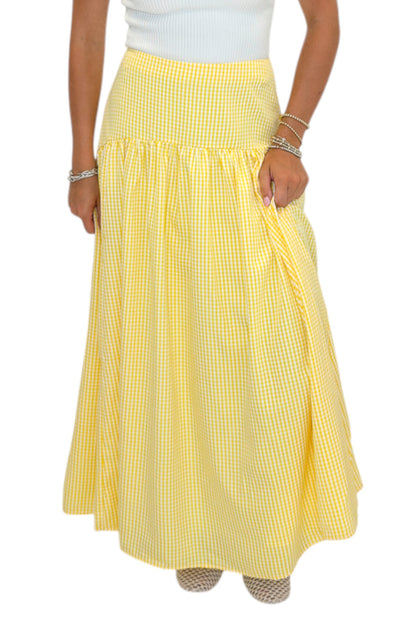 Front detail view of woman wearing Swagger Boutique’s Yellow Gingham Skirt with white top against white studio background.