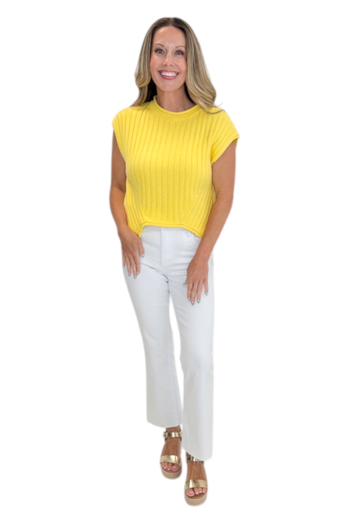 Front view of woman wearing Swagger Boutique’s Yellow Ribbed Detail Sleeveless Sweater by Entro with jeans against white studio background.