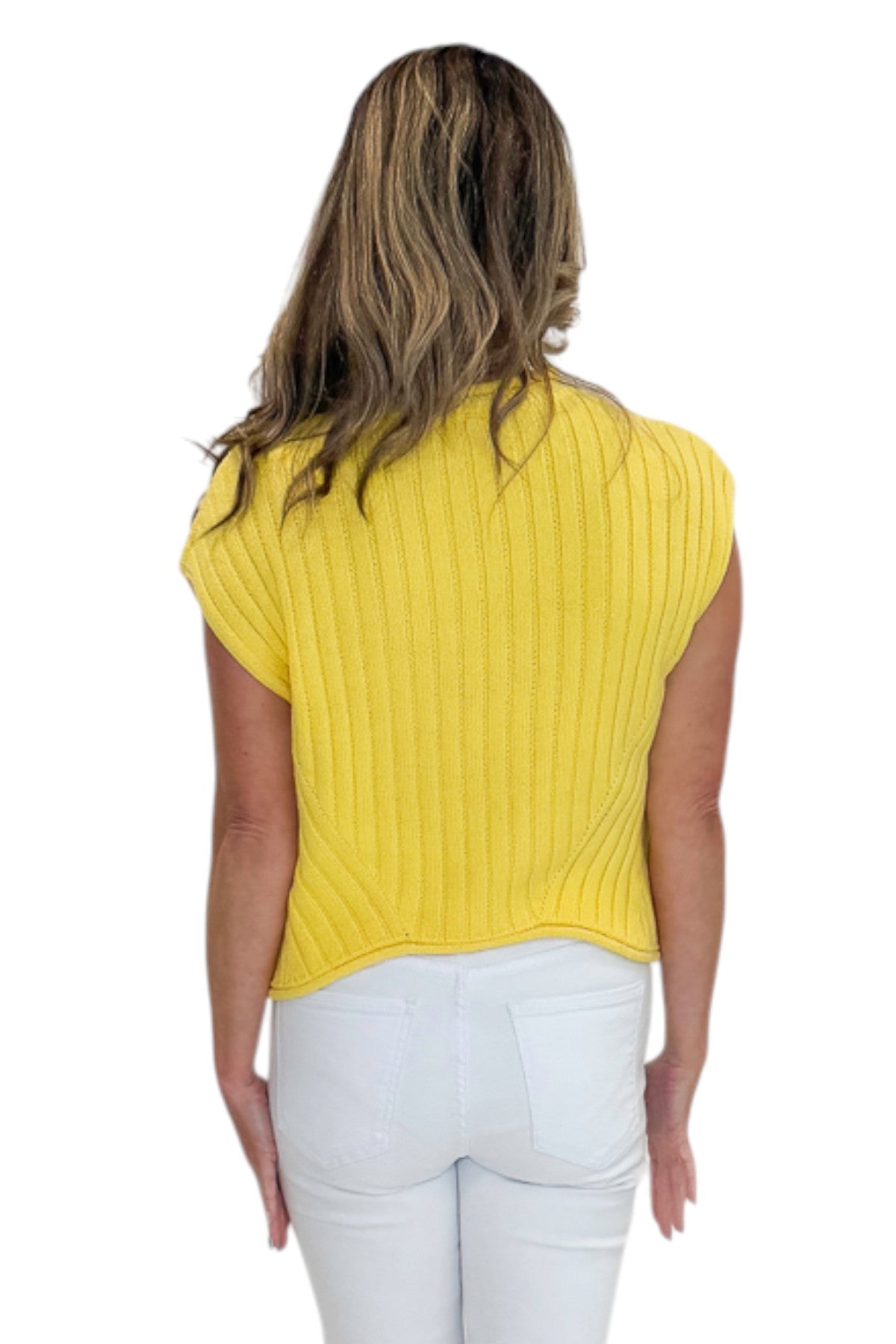Back view of woman wearing Swagger Boutique’s Yellow Ribbed Detail Sleeveless Sweater by Entro with jeans against white studio background.
