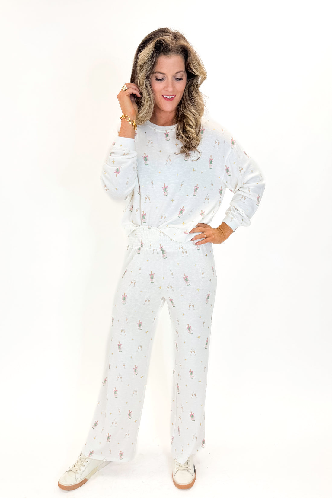Front view of woman wearing Vanilla Ice Dawn Champagne Lounge Pants with matching top against white studio background.