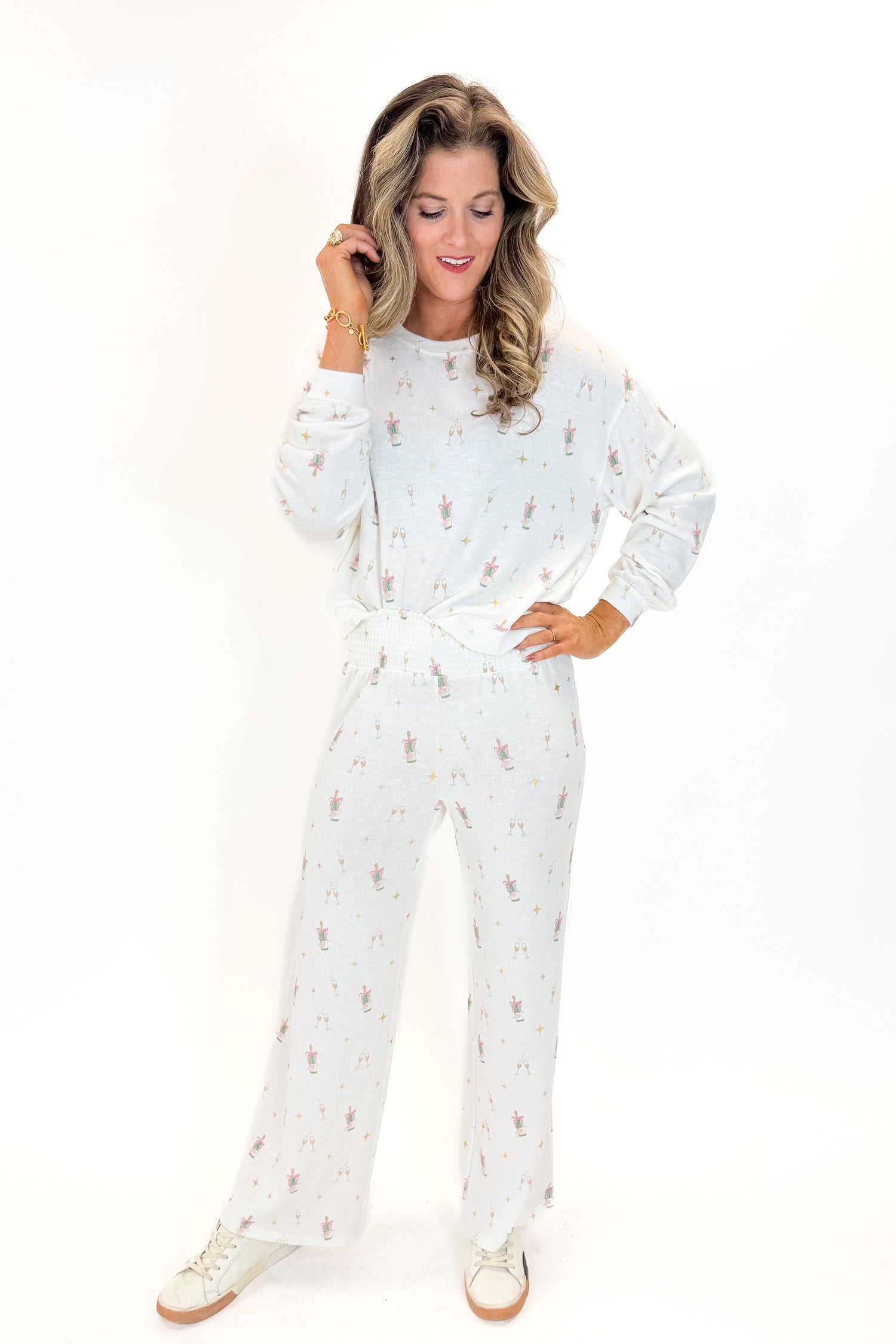 Front view of woman wearing Vanilla Ice Dawn Champagne Lounge Pants with matching top against white studio background.