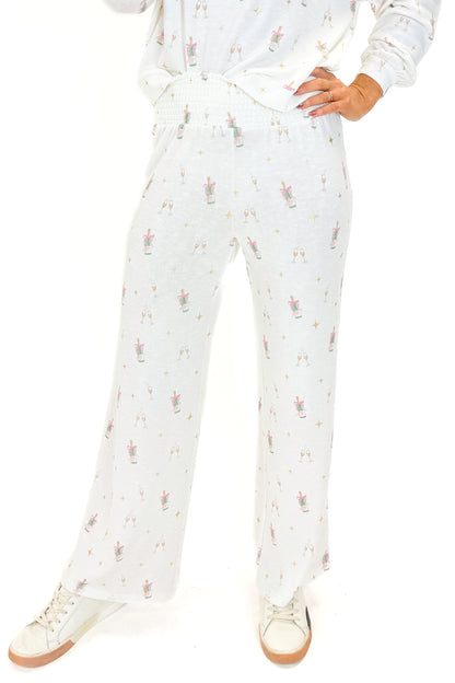 Front view of woman wearing Vanilla Ice Dawn Champagne Lounge Pants with matching top against white studio background.
