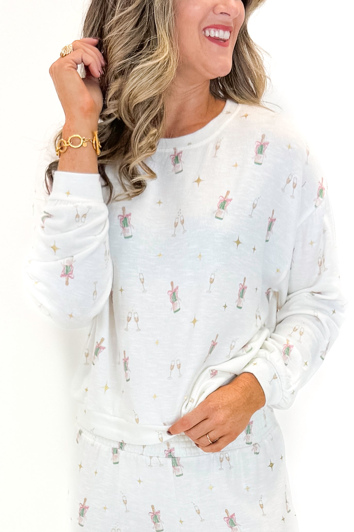 Front view of woman wearing Vanilla Ice Champagne Long Sleeve Top with matching pants against white studio background.