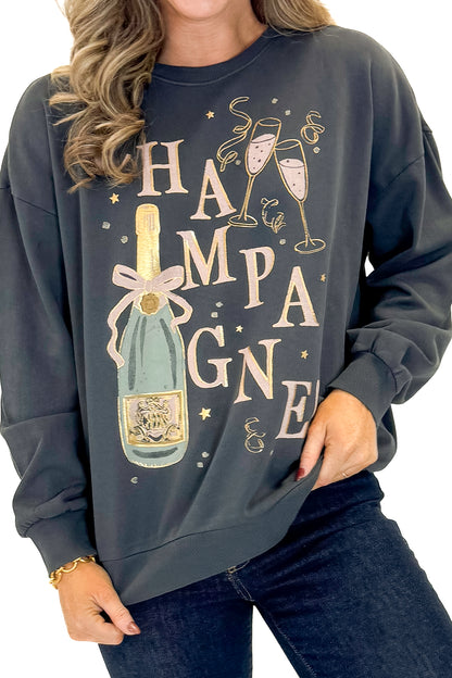 Front detail view of woman wearing Black Celebrate Sunday Sweatshirt with jeans against white studio background.