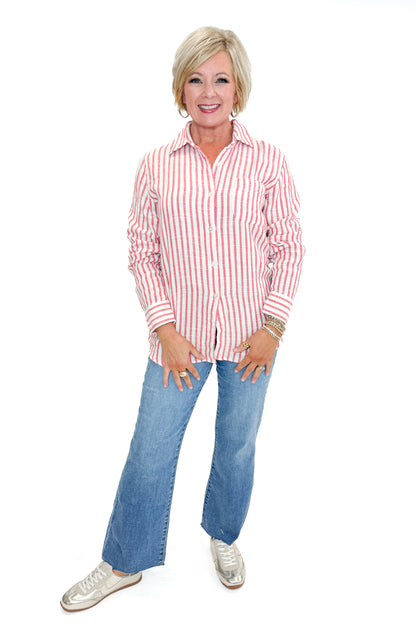 Front view of woman wearing Crimson Crush Saturdays Stripe Shirt by Z Supply with jeans against white studio background.