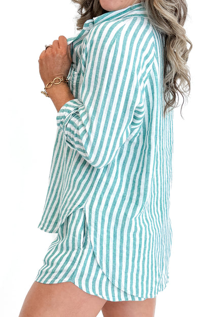 Side view of woman wearing La Palma Perfect Line Shorts by Z Supply with matching top against white studio background.