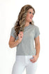 Front view of woman wearing Heather Grey Modern Slub Tee by Z Supply with jeans against white studio background.