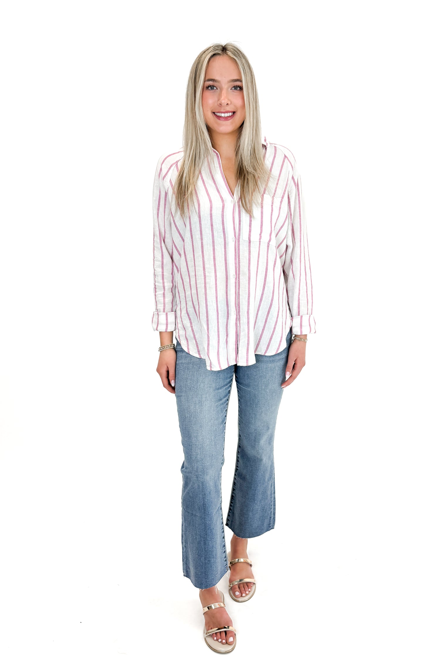 Front view of woman wearing The Perfect Line Top In Spanish Rose by Z Supply with jeans against white studio background.