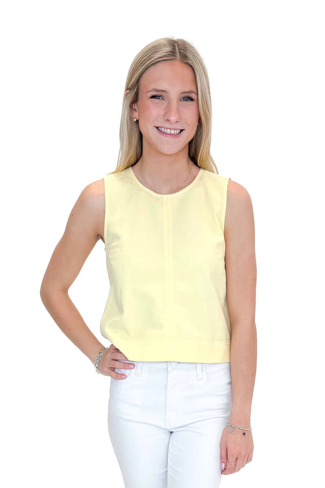 Front view of woman wearing Sunnyside Sun Seeker Tank by Z Supply with jeans against white studio background.