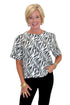 Front view of woman wearing Swagger Boutique’s Zebra Print Button Down Top with jeans against white studio background.
