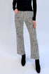 Front view of woman wearing Swagger Boutique’s top with Zebra Straight Leg Jeans by Just Black Denim against white studio background.