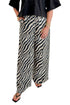 Front view of woman wearing Swagger Boutique’s Black Collared Short Sleeve Top with Zebra Wide Leg Pants by Entro against white studio background.