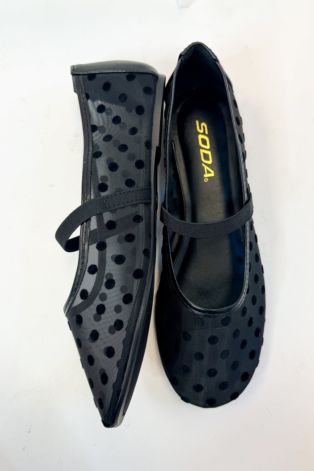 Zenda- Black Polka Dot Mesh Flat against studio background