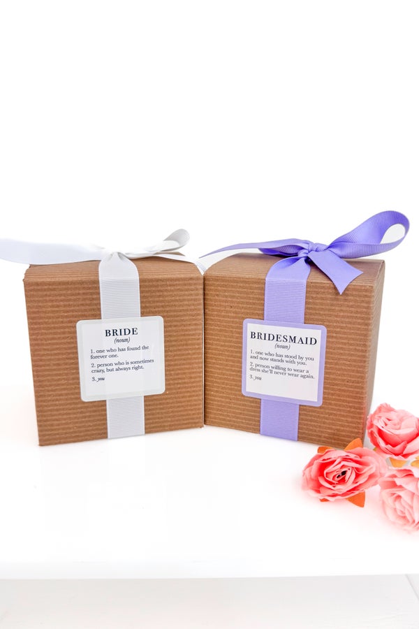 Two gift boxes labeled &