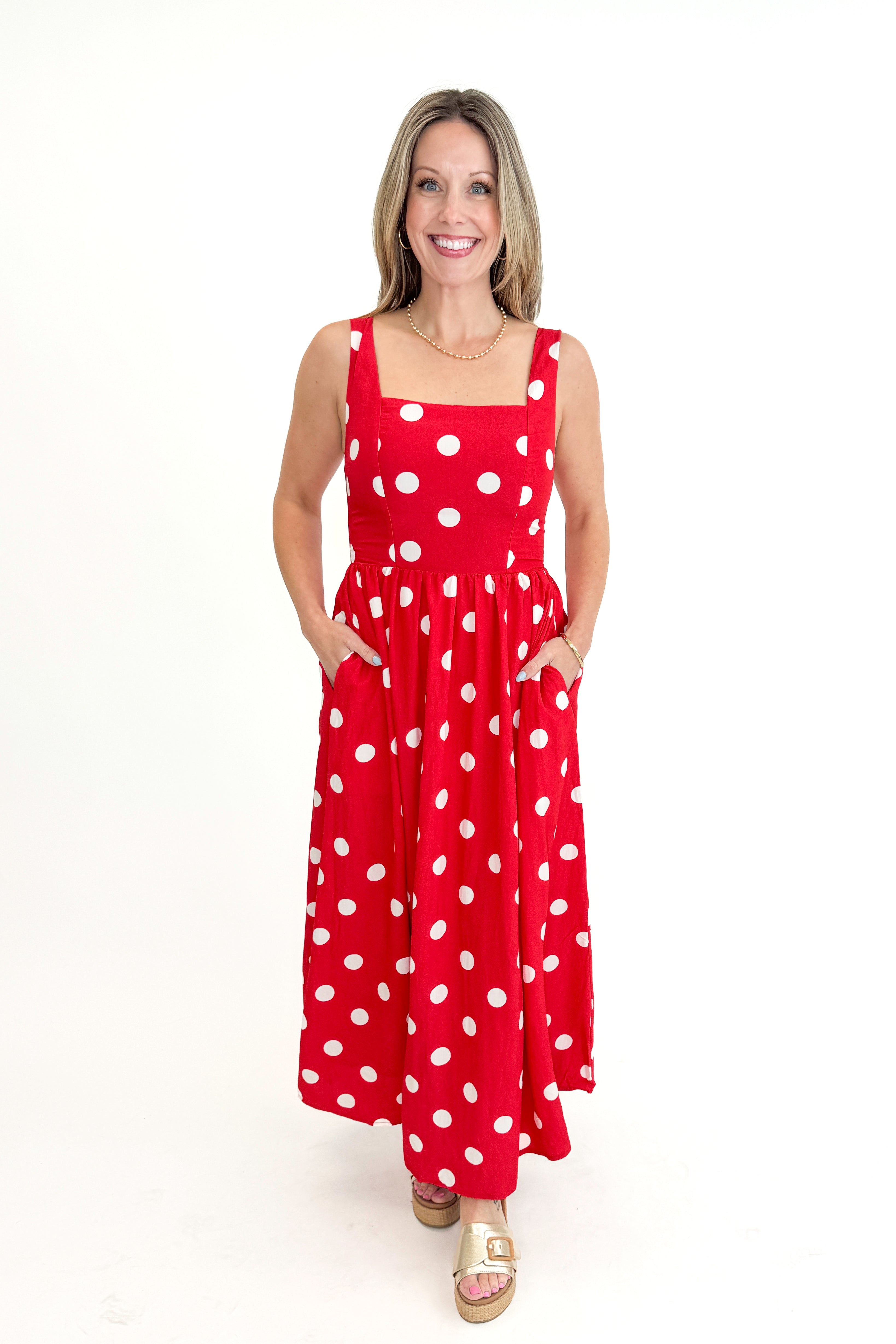 Front view of woman wearing Red &amp; White Polka Dot Midi Dress against white studio background.