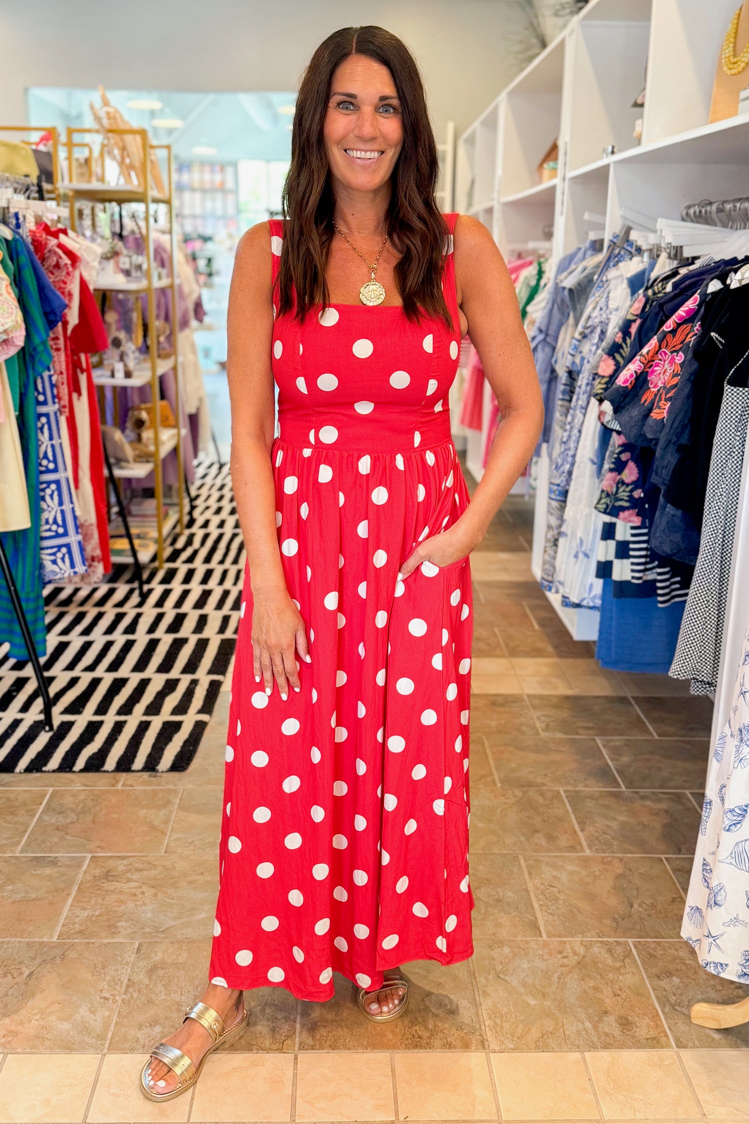 Front view of woman wearing Red &amp; White Polka Dot Midi Dress with sandals at Swagger Boutique.