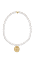 A delicate beaded bracelet featuring pearls and a small gold cross charm shown on a plain white background.