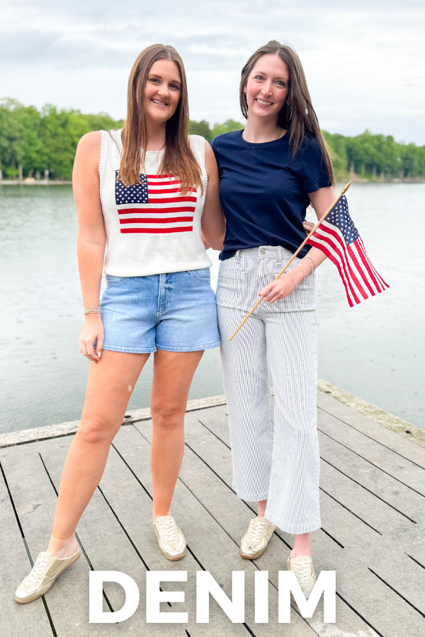 Two women standing on a dock by a lake, holding American flags, with 'Denim' text overlay.