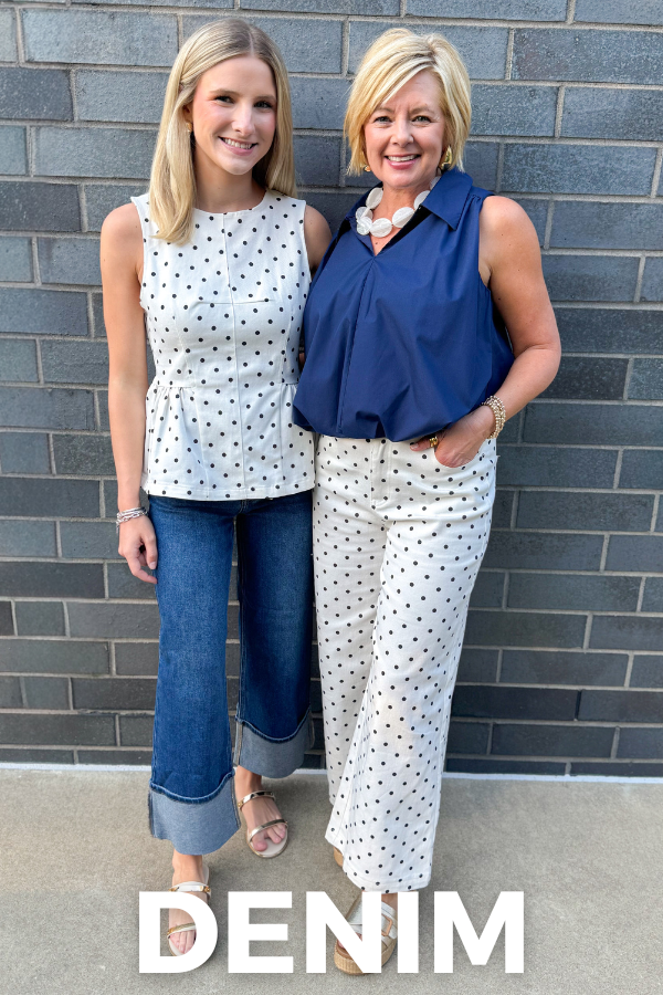 Two women standing against a brick wall, wearing polka dot tops and jeans with 'DENIM' text overlay.