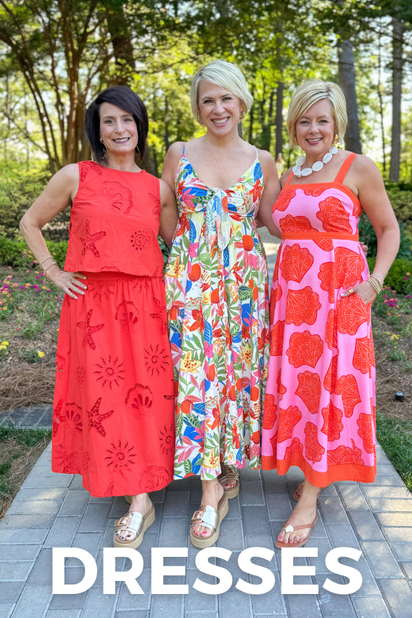 Three women wearing dresses standing outdoors with 'DRESSES' text overlay.