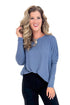 Shades Of Change dusty blue dolman sleeve top - front view on model with shirt tucked