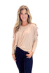 Front view of woman wearing Taupe Dolman Sleeve Top with jeans against white studio background.