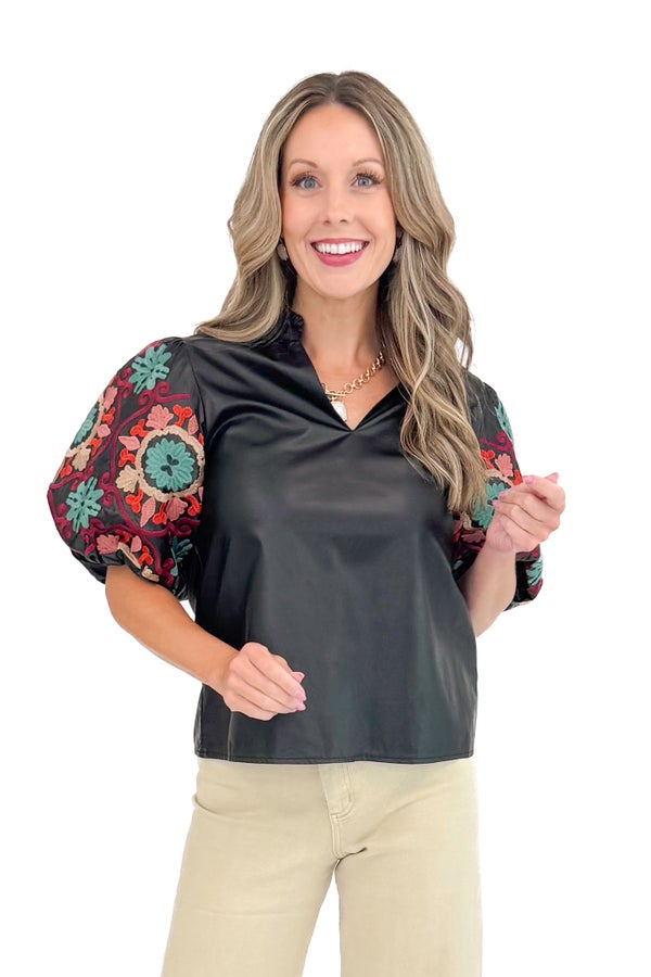 New Dawn black faux leather top with embroidered sleeves - front view on model