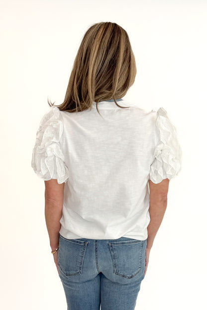 Back view of woman wearing White Ruffle Sleeve Detail Top by Fate with jeans against white studio background.