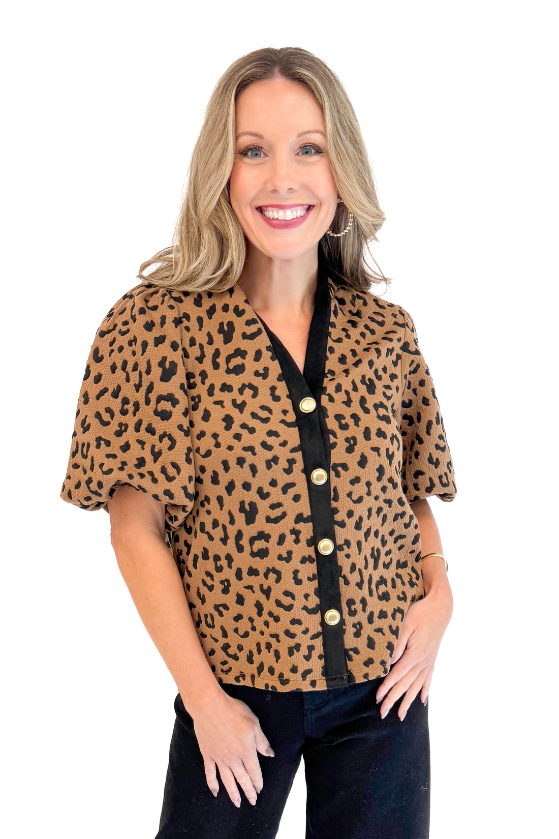 Front view of woman wearing Leopard Puff Sleeve Textured Top by THML.